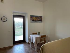 a dining room with a table and a window at LA QUERCIA Appartamenti in Ortona