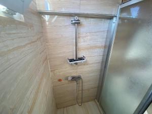 a shower stall with a hose in a bathroom at Camel Apartment in Antalya +49 photos