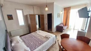 Letto o letti in una camera di IVERIA BEACH