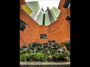 a building with a pile of rocks in front of a building at Super quiet Dry bath floor OLED TV Closet room in Seoul