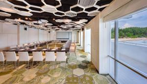 a conference room with a long table and chairs at The Nai Harn in Nai Harn Beach
