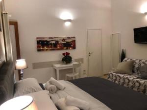 En eller flere senge i et værelse på NAVONA DOMITIA HOME