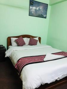 Letto o letti in una camera di Yeti Cozy Hotel