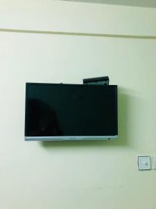 TV o dispositivi per l'intrattenimento presso Yeti Cozy Hotel