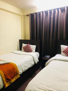 Letto o letti in una camera di Yeti Cozy Hotel