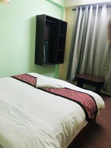 Letto o letti in una camera di Yeti Cozy Hotel