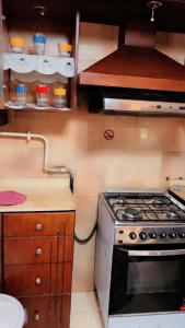 a kitchen with a stove and a counter top at شقه فندقيه الترا سوبر لوكس بارقي مناطق اسيوط in Asyut