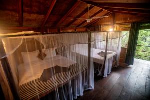 Cama o camas de una habitación en INN On The Tree Eco Resort Sigiriya