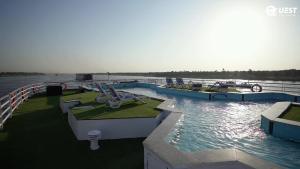 een zwembad op een boot in het water bij M/S Nile Quest Cruise - 4 or 7 Nights From Luxor each Monday and 3 or 7 Nights From Aswan each Friday in Luxor