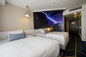 Postel nebo postele na pokoji v ubytování Science Hotel