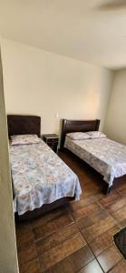 Postel nebo postele na pokoji v ubytování Pousada Brilhante Itirapina