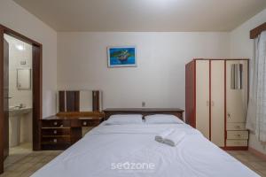 Voodi või voodid majutusasutuse Casa a 2 quadras do mar em Porto Belo BRR0097 toas