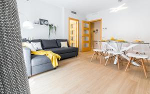 a living room with a couch and a table at Top family apartment by Lofties in Terrassa +44 photos