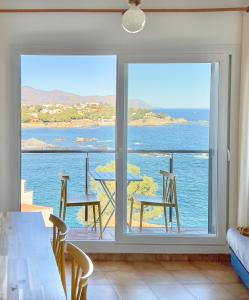 a living room with a view of the ocean at Majordoms - Apartment Cau del Llop, Llança in Llança