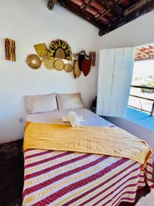 En eller flere senge i et værelse på Hospedaria Passos do Mar, Caraíva