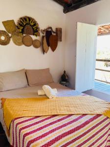 En eller flere senge i et værelse på Hospedaria Passos do Mar, Caraíva