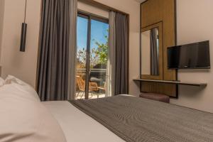Jiva Beach Resort - Ultra All Inclusive的电视和/或娱乐中心