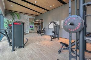a gym with several exercise equipment in a room at Frank Porter - Vida Residences in Dubai