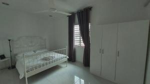 Katil atau katil-katil dalam bilik di D'Sandra Homestay