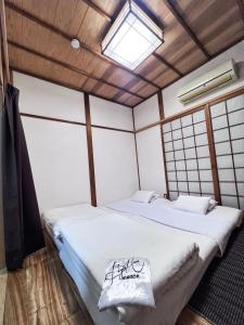 Postel nebo postele na pokoji v ubytování Bighem Maison 2
