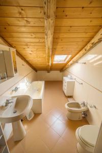 a bathroom with a sink and a toilet at Palazzo Marchesale, vista mare in Pisciotta