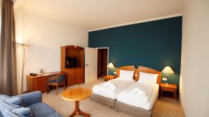 Postel nebo postele na pokoji v ubytování Seehotel Borkum