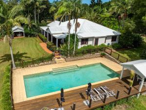an aerial view of a house with a swimming pool at Cedia at Byron Bay Hinterland in Byron Bay