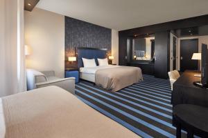 Postel nebo postele na pokoji v ubytování Van der Valk Hotel Sneek + 37 fotografií