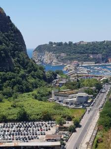 an aerial view of a city with a mountain at Romeo house in Naples