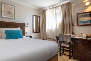Postel nebo postele na pokoji v ubytování Teclados Hotel
