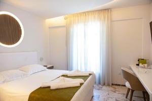 Letto o letti in una camera di Tzanis Resort Skyros