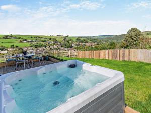 a jacuzzi tub on top of a yard at 2 Bed in Sowerby Bridge 93344 in Ripponden