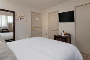 Postel nebo postele na pokoji v ubytování Teclados Hotel