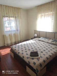 Un pat sau paturi într-o cameră la Vila Maria