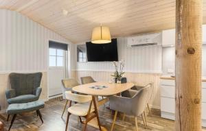 a kitchen and dining room with a table and chairs at Gorgeous Home In Otterup With Wifi in Otterup