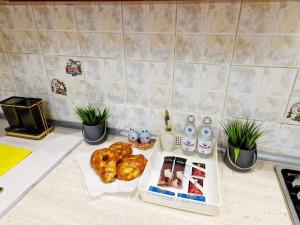 a kitchen counter with bread and other items on it at Просторная 3 комнатная квартира in Taraz +7 photos