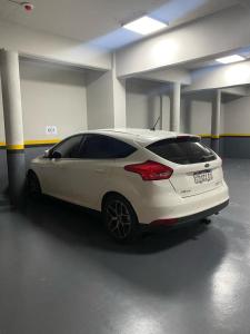 a white car parked in a parking garage at Departamento Nuevo con Vista al Río - Edificio Marwa - Zona Residencial in Posadas