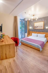 Llit o llits en una habitació de Solo Grand Boshuri Hotel Wellness Resort