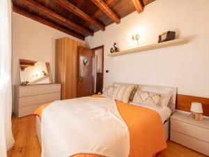 Katil atau katil-katil dalam bilik di Holiday Home Da Norma by Interhome