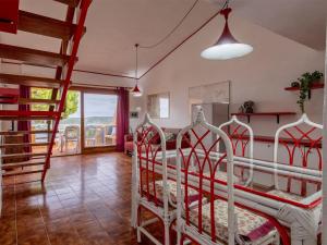 a bedroom with two white beds in a room at Apartment I-1-4 by Interhome in Golfo Aranci +36 photos