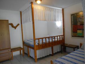 a small bedroom with a bunk bed and a bed at PATMOS Mathios Studios- apartments in Patmos