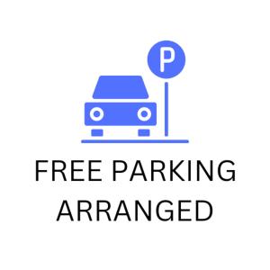 a parking sign with the words free parkingenced at Henrietta Suites City Centre in Dublin