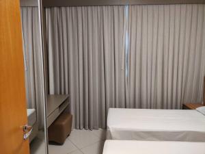 Postel nebo postele na pokoji v ubytování Condomínio Barretos Thermas Park Apto 514 + 6 fotografií