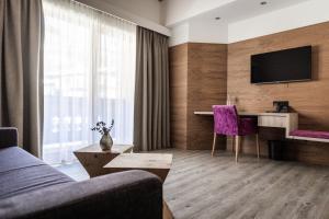 A television and/or entertainment centre at Hotel Sonnegg
