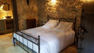 Katil atau katil-katil dalam bilik di Le Donjon des Combes et son Spa