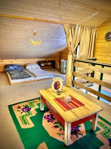 a room with a table and a bunk bed at Splav Cilim House in Belgrade