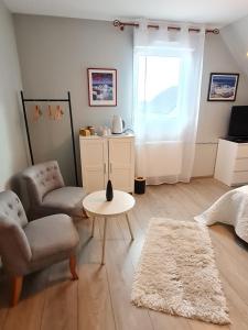 Posezení v ubytování La Maison De Roméo
