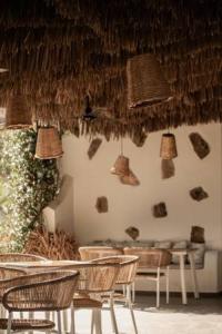a room with chairs and lamps on the wall at Kohylia by La Scala Beach in Limenas