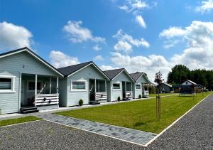 a row of white houses in a row at Biała Mewa Gąski in Gąski