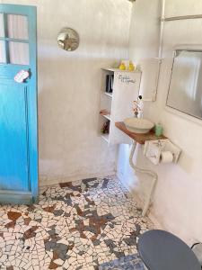 a bathroom with a sink and a toilet at Satori in Barra de Valizas